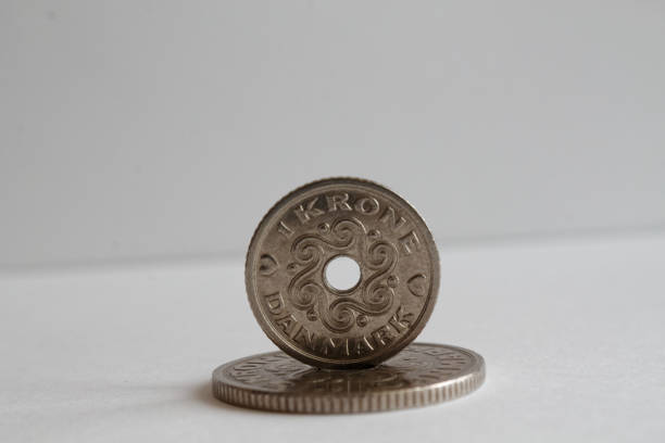Two Denmark coins denomination is one krone (crown) lie on isolated white background Two Denmark coins lie on isolated white background Denomination is 1 krone (crown) elefant stock pictures, royalty-free photos & images
