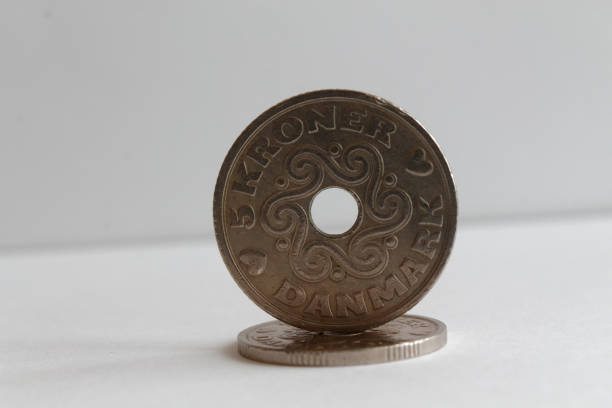 istock Two Denmark coins denomination is five krone (crown) lie on isolated white background 899316906