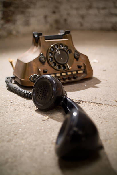 istock Antique telephone with handset in the foreground. 89931740