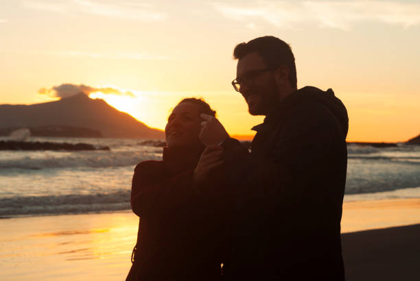 istock Couple in a sunset time 899317766