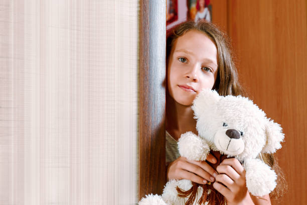 istock girl with plush toy 899320456