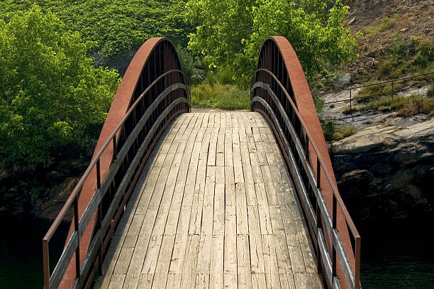 Curved Bridge Crossing a River stock photo