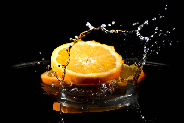 citrus fruit falling stock photo