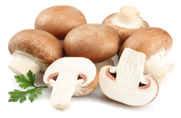 istock Fresh champignon mushrooms isolated on white background 899329158
