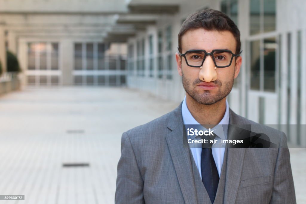 Spy wearing a funny disguise Spy wearing a funny disguise. Hiding Stock Photo