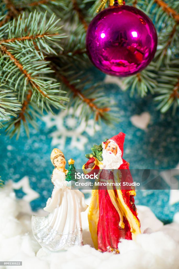 Christmas card background Santa Claus and Snow Maiden Russian Christmas characters: Snegurochka Snow Maiden with gifts bag Christmas card background Santa Claus and Snow Maiden Russian Christmas characters: Ded Moroz Father Frost and Snegurochka Snow Maiden with gifts bag Adult Stock Photo