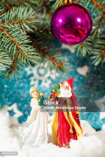 Christmas Card Background Santa Claus And Snow Maiden Russian Christmas Characters Snegurochka Snow Maiden With Gifts Bag Stock Photo - Download Image Now