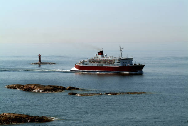 istock Cruise ship sailing with lighthouse on the background 89933073