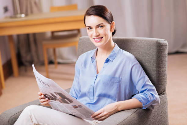 istock Glad vigorous woman finishing reading article 899331496