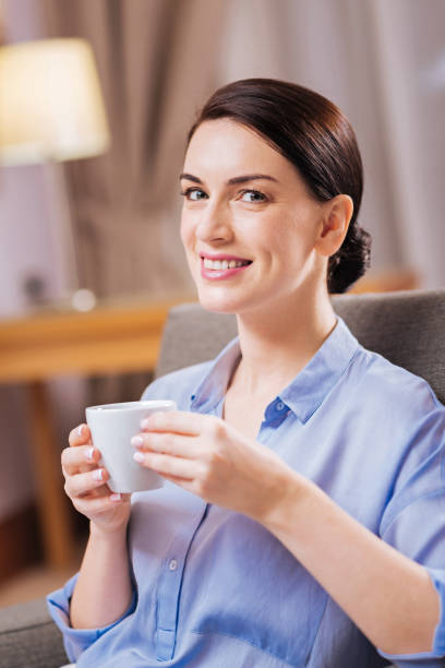 istock Brunette attractive woman smiling with coffee 899331566