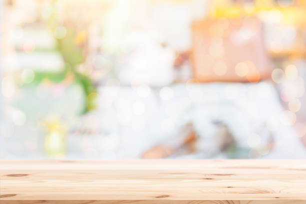 istock Wood table with blur showcase for products display background. 899339110