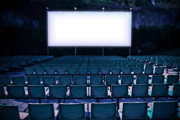 istock Outdoor cinema with white projection screen - toned image 899342636