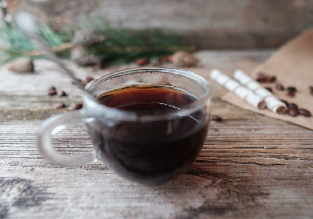 istock black coffee in glass Cup on wooden table 899346368