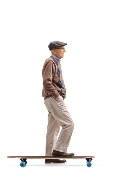 istock Senior with a longboard waiting in line 899346612