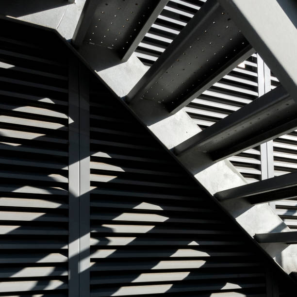 istock Close-up of shady iron stairs 899347012
