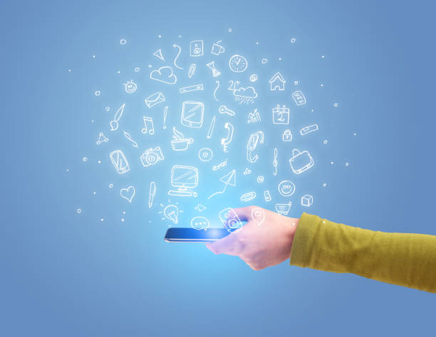 istock Hand with phone and drawn office icons 899350258