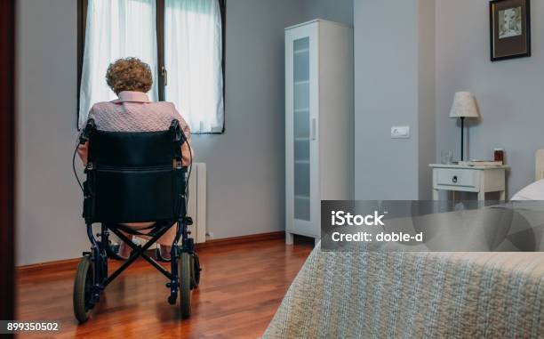 Senior Woman In A Wheelchair Alone Stock Photo - Download Image Now - Senior Adult, Loneliness, Sadness