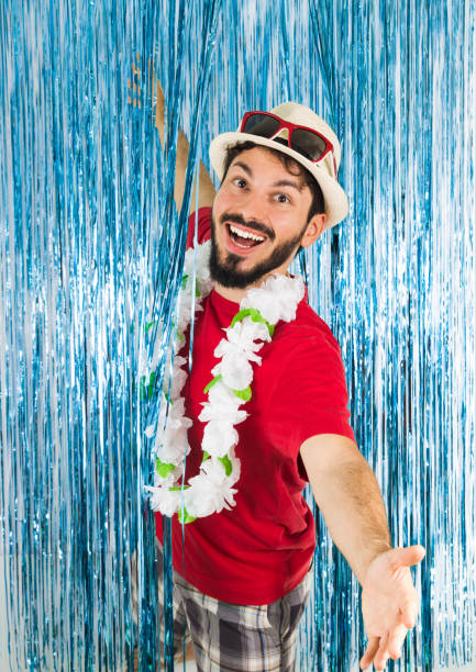 young brazilian is with open arms and a big smile. caucasian man in red clothes and sunglasses. funny. euphoria and joy. carnival, new year's eve, mardi gras."n - half smile imagens e fotografias de stock