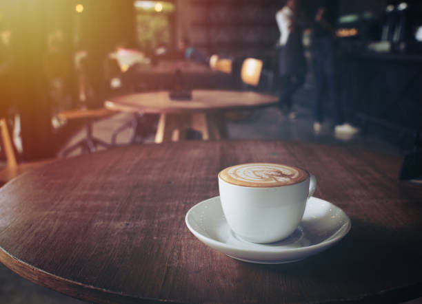 istock cup of coffee on table in cafe,vintage style. 899351040