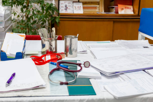 istock Paperwork in medicine at doctor's office, Workspace 899352568