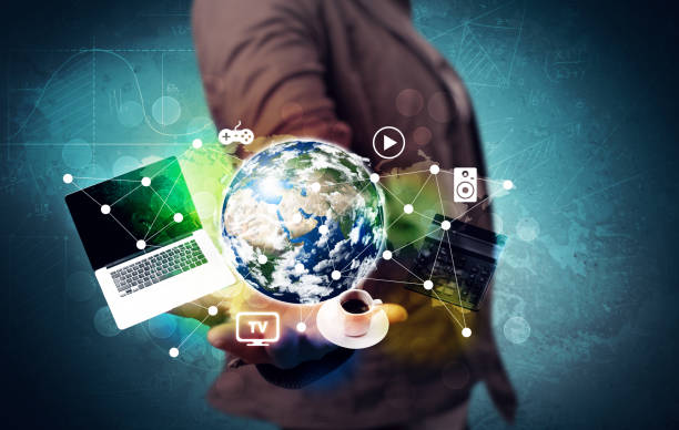 istock Business person holding laptop and globe 899355054