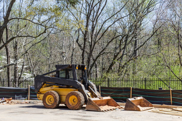 Front End Loader at Silt Fence Front End Loader at Silt Fence on construction site silt stock pictures, royalty-free photos & images