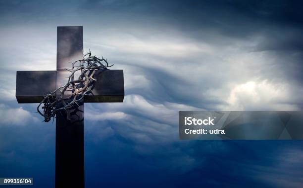 Easter Cross With Crown Of Thorns Against Blue Sky Abstract Background With Empty Space Stock Photo - Download Image Now