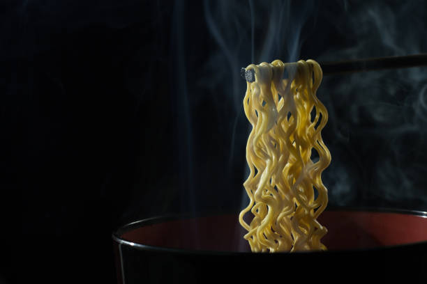istock Eat hot noodles, black backdrop,Instant noodles delicious black backdrop 899359908