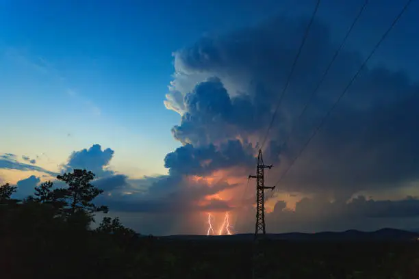 Panoramic shot of a beautiful summer storm with sunset, Slovenia