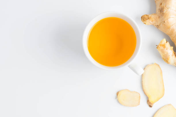 istock hot ginger tea ginger ale ginger beer in glass with ginger slice on white background 899362932