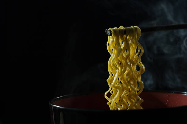 istock Eat hot noodles, black backdrop,Instant noodles delicious black backdrop 899364146