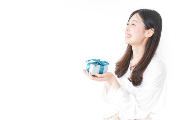 Young woman giving a present to someone