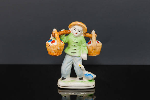 istock oriental figure carrying baskets salt and pepper shakers 899369480