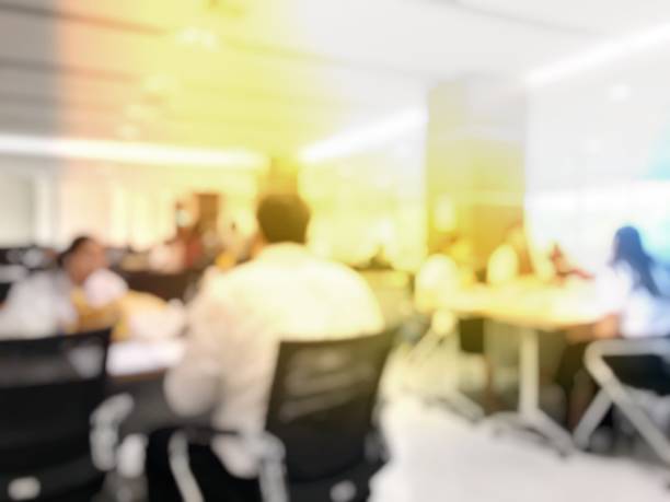 istock Blurred image background of group students and freelancers working at coworking space for searching for books / practice homework and preparing for the final examination in library at university 899371884