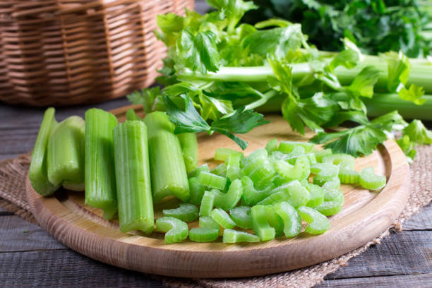 istock Sliced frozen celery on a cutting wooden board 899372416