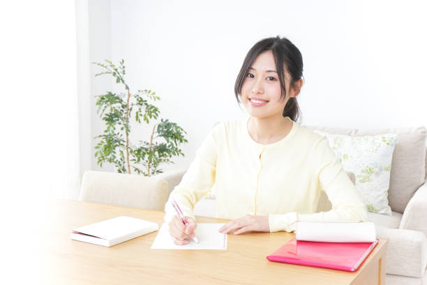 istock Female student studying for an entrance exam at home 899372506