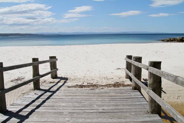 istock Wooden walkway leading to beautiful beach 899372784