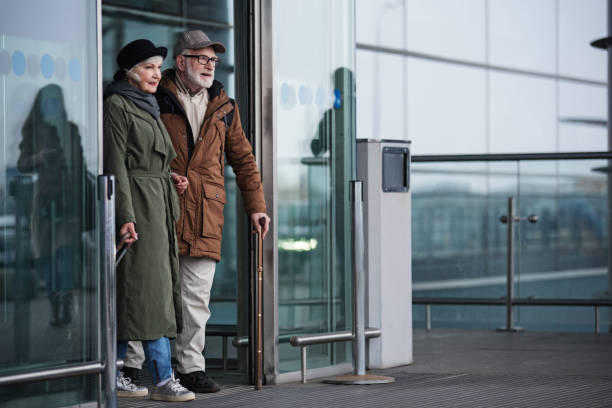 istock Aged couple is coming out from airport 899379930