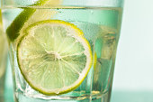 closeup of a cape cod cocktail or vodka cranberry on a blue background
