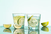 closeup of a cape cod cocktail or vodka cranberry on a blue background