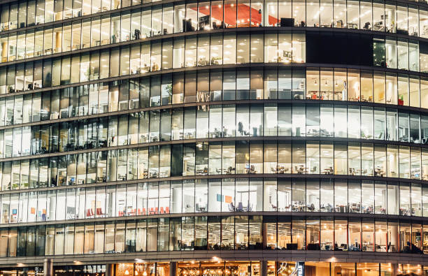 istock Hard working professionals working late in their offices 899384168