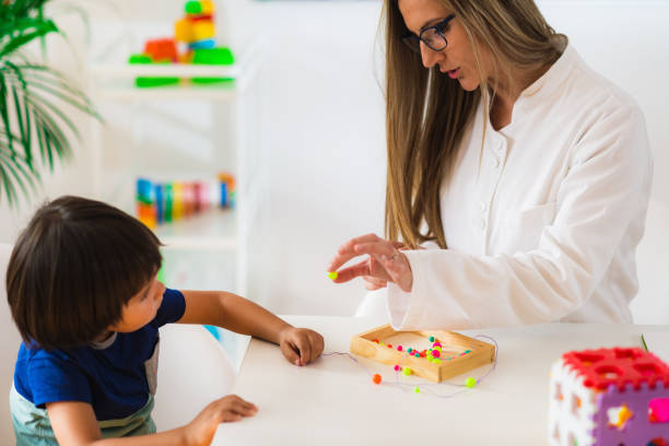 istock Child psychology, preschooler doing tests 899385382