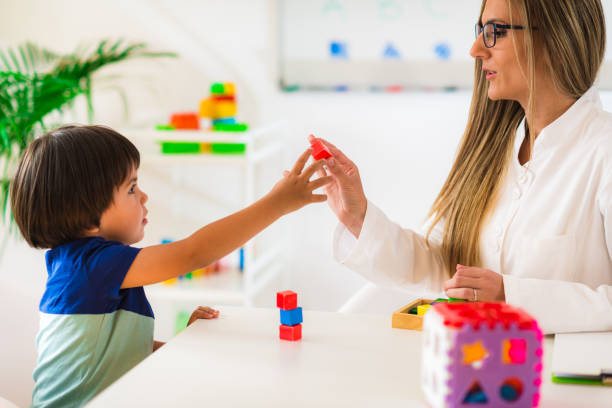 istock Child psychology, preschooler doing tests 899385388