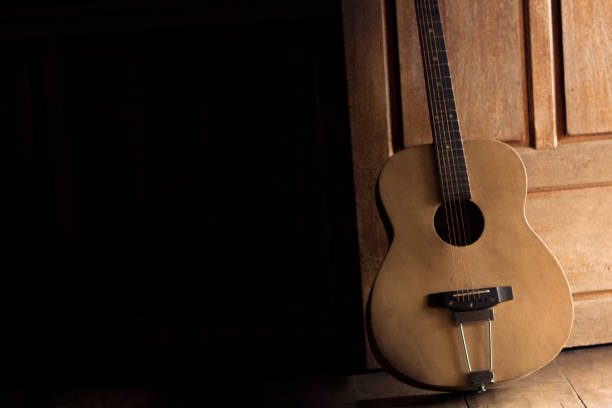 istock Old wood guitar Dark tone, lack cable 899385662