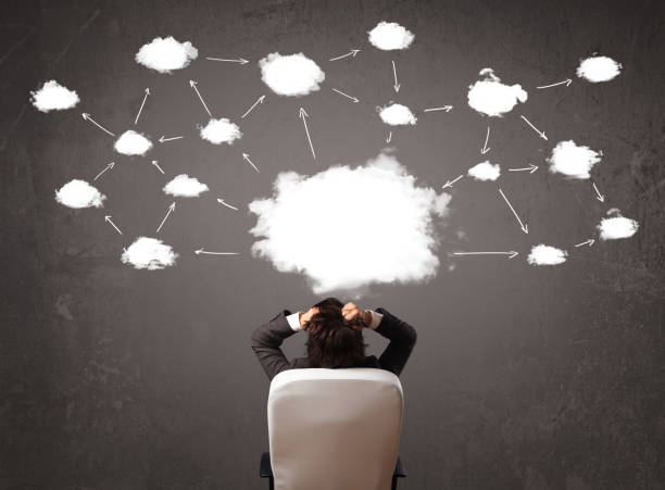 istock Businessman sitting with cloud technology above his head 899385762