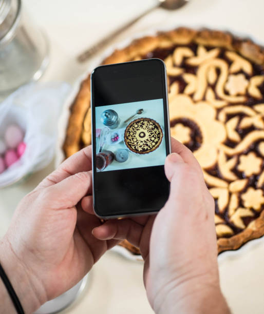 istock Person taking a Food Picture 899386636