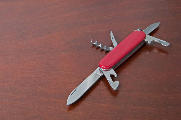 Utility knife on office table stock photo