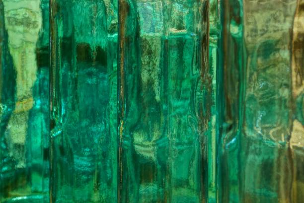 istock bright green background of thick clear glass 899405462