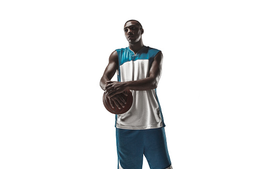 The portrait of a basketball player with a ball isolated on white studio background. advertising concept
