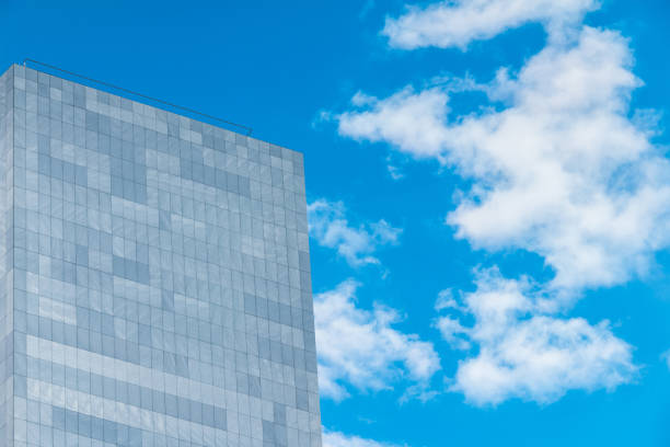 istock Wall of modern building on background of sky 899406326